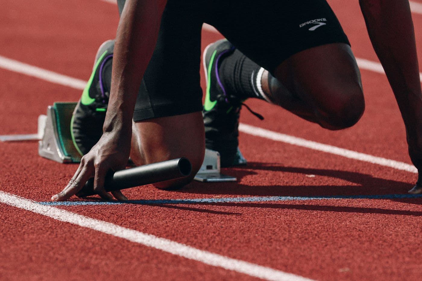 A sprinter set in the blocks before a race
